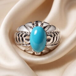 High-grade sky-blue Neyshabur turquoise oval cabochon set in a handmade sterling silver ring