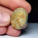 Back of the Nishapur turquoise cabochon, showing the natural host rock the stone grew inside